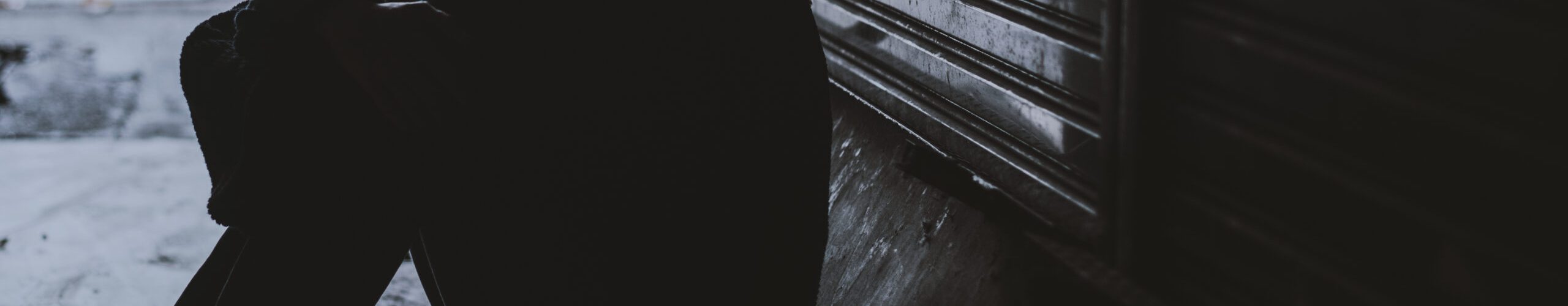 Homeless Woman Sitting on The Street Side Hopeless